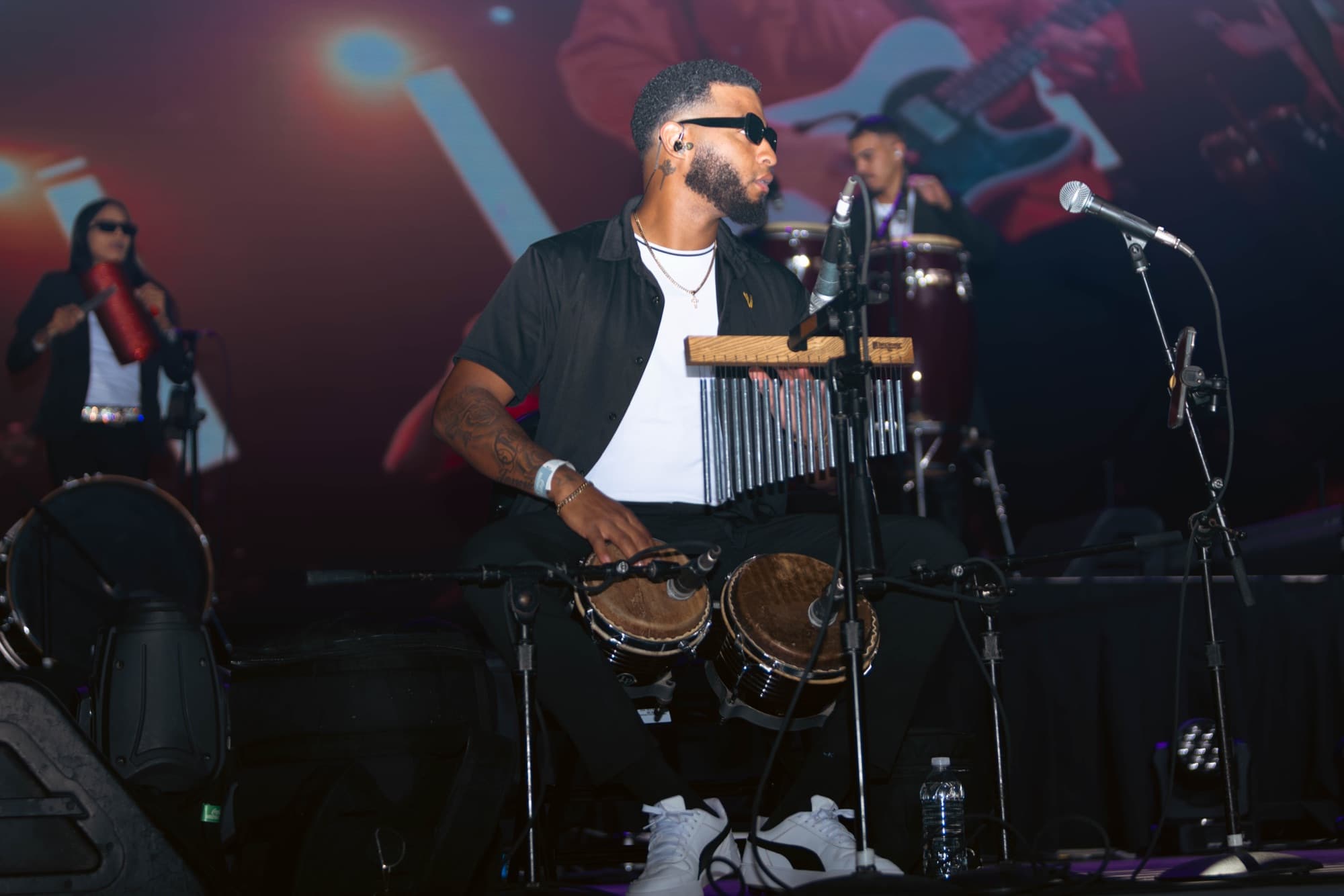 Percussionist working the congas and chimes
