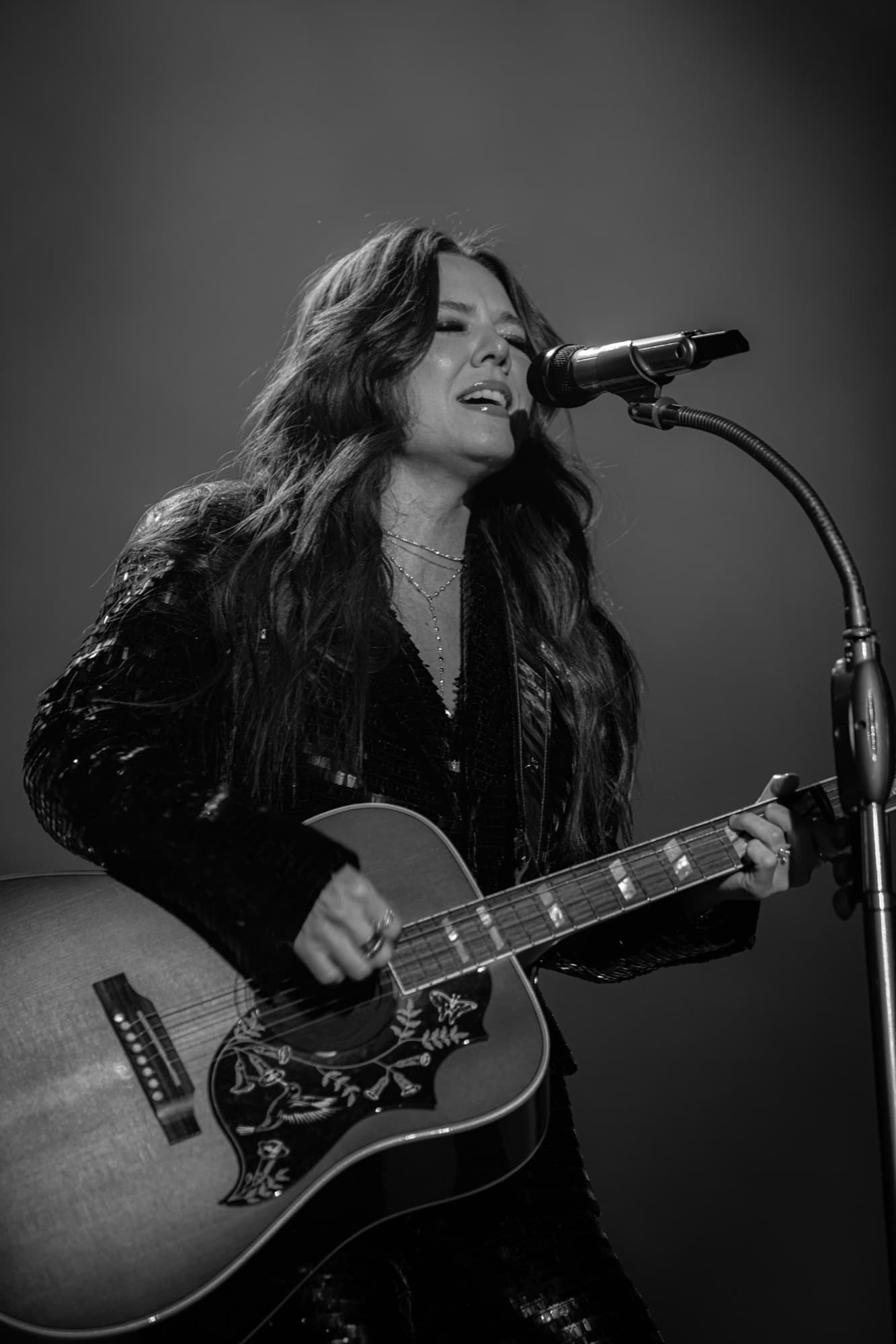 Joy at the microphone in black and white