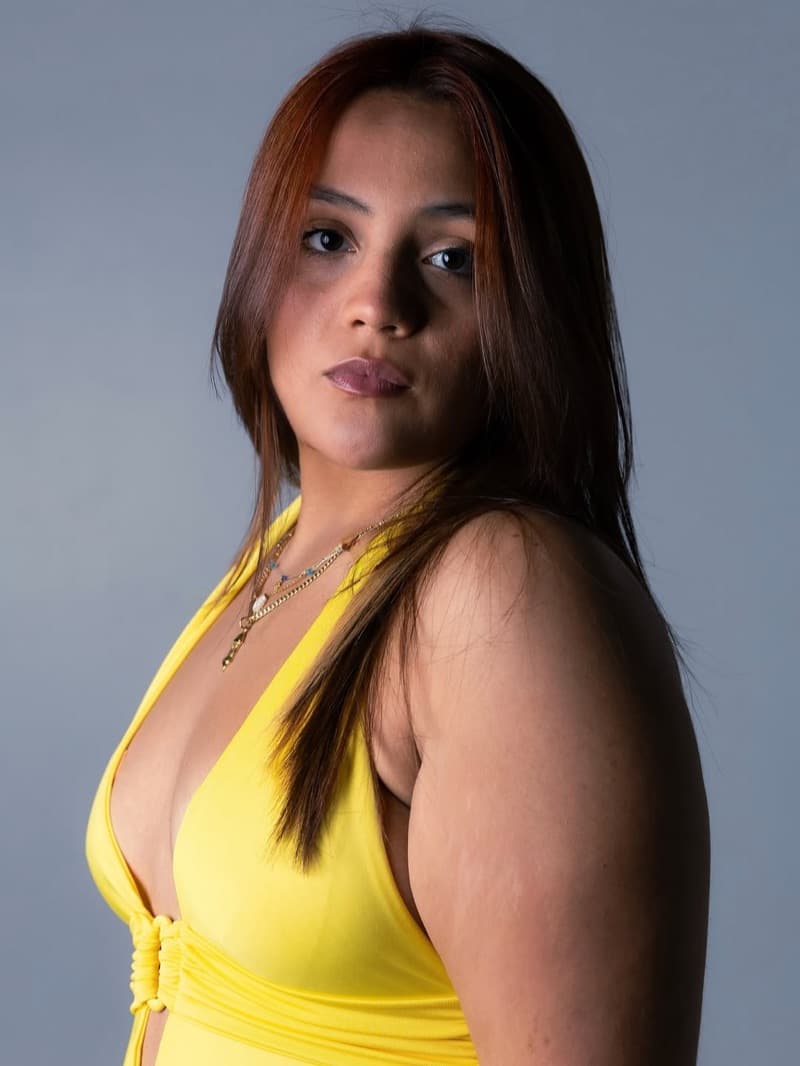 Studio portrait of Salomé with red hair