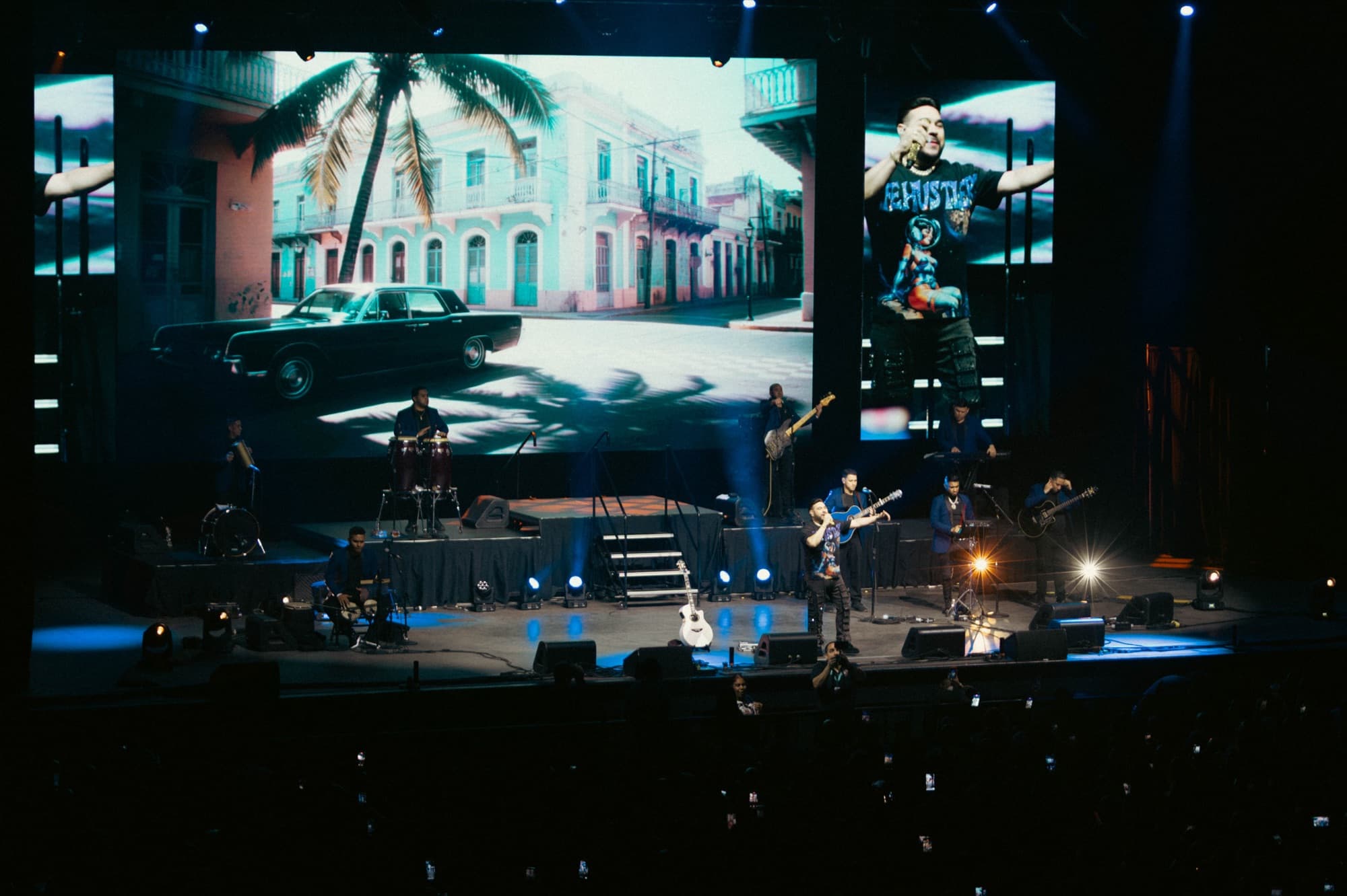 Arena stage with Old San Juan visuals on the screens